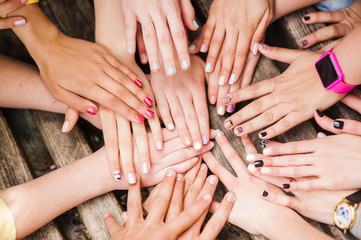 Hands of young people in the nature