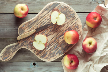red apples lie on chopping board