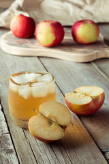 Naklejka na ściany i meble glass of juice and apples on a cutting board