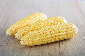 corns on a wooden surface