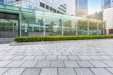 empty pavement front of modern architecture