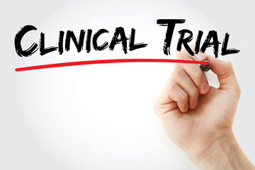 Hand writing Clinical Trial with marker, concept background