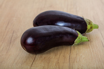 eggplants on a wooden surface
