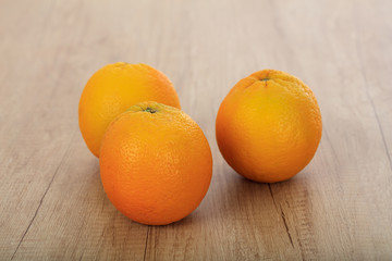 oranges on a wooden surface