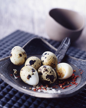 Quails eggs with salt and red peppercorns