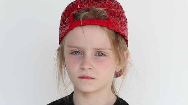 Child with regret looking at the camera,portrait of a sad girl