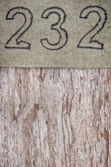 Linen grunge burlap texture on weathered wooden background