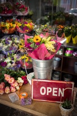 Open signboard on a wooden table