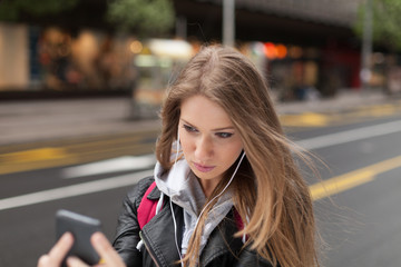 Fototapeta premium girl listening to music and take selfie