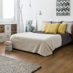 Marital bed in snug bedroom