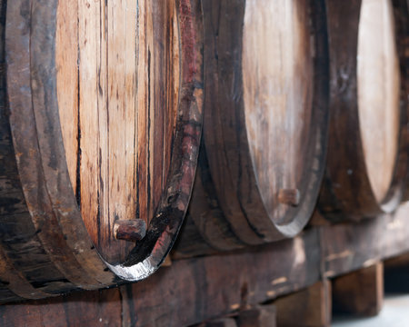 Old wine barrels in the wine cellar, Madeira island, Portugal. 