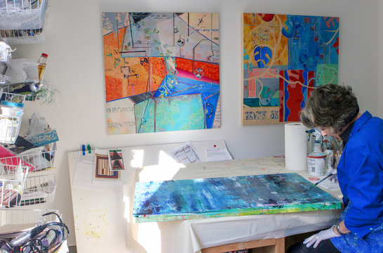 Artist painting canvas