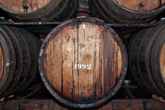 Old wine barrels in the wine cellar, Madeira island, Portugal. 