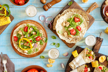 Tortilla with grilled chicken fillet, lager and grilled vegetabl