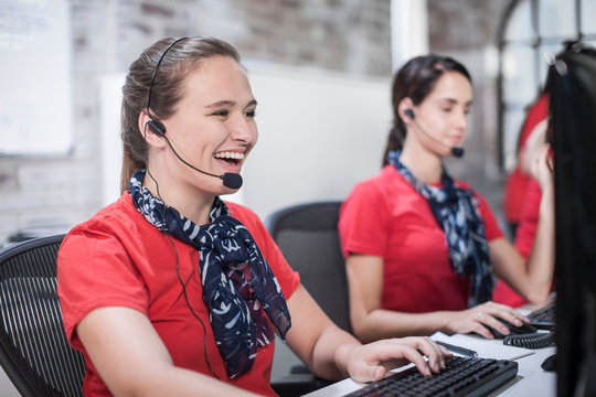 Row of female telephonists working in call centre