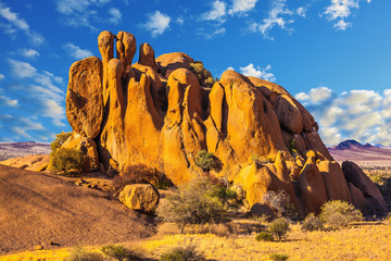 The stone arches painted in red and orange