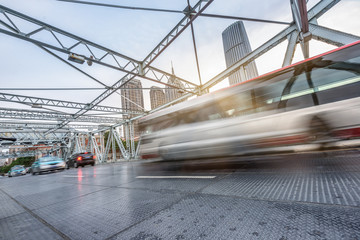 motion blurred traffic at steel bridge