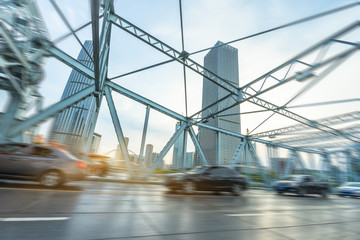 motion blurred traffic at steel bridge