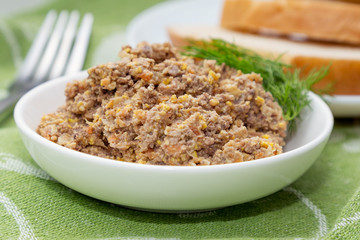 Homemade pate from a liver, carrots, garlic and eggs with dill o