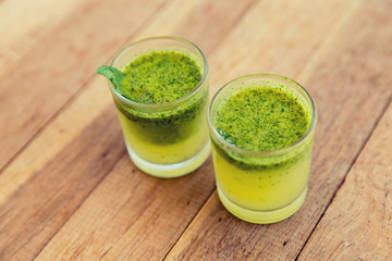 glasses of fresh juice or cocktail on beach