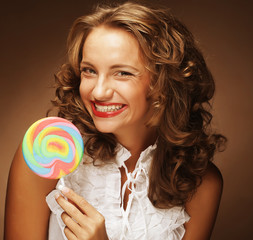 curly  girl with a lollipop in her hand 