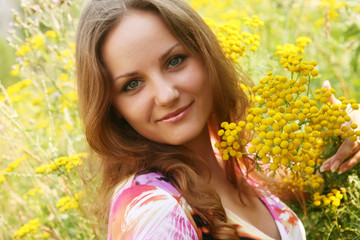 young woman and wild flowers. 