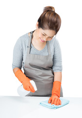 Naklejka premium asian housewife sweeping on table