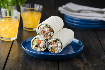 Tuna burritos with avocado tomato and mayonnaise