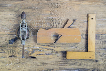 Rustic woodworking tools on old wooden table. Top view. copy spa