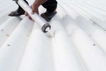 Roof leak and crack repair with caulking gun