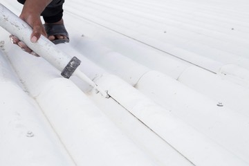 Roof leak and crack repair with caulking gun