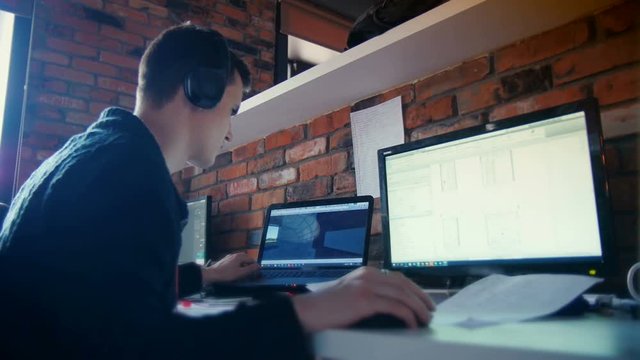 Man Working At Computer In Contemporary Office