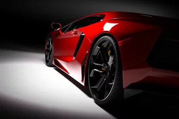 Foto op Aluminium Rode snelle sportwagen in schijnwerpers, zwarte achtergrond. Glanzend, nieuw, luxueus. © Photocreo Bednarek