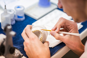 Obraz na płótnie Canvas Aesthetic dentistry technician working in his office