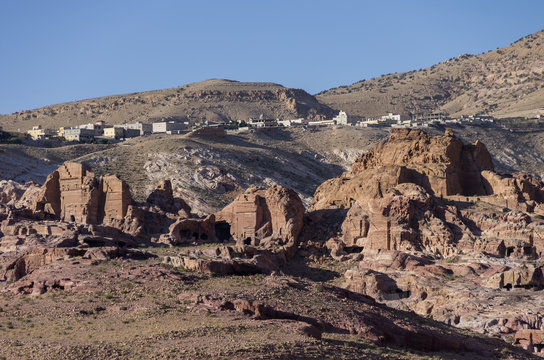 Ruin of Moghar Annassara (Christian Tombs )  in Petra and Uum Sayhoun village at background, Jordana