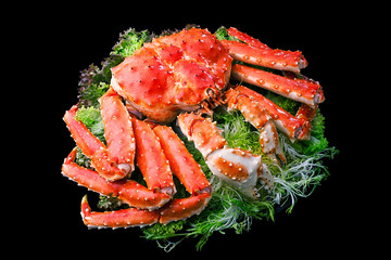 Top view of Red king crab served on black background
