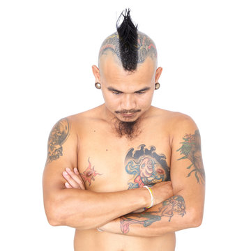 portrait of asian punk guy with mohawk hair style, piercing and