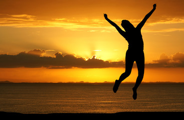 Woman Jumping At The Beach