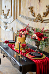 wedding table in gold and red colors