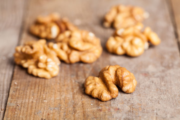 Walnut kernels on rustic old wooden table
