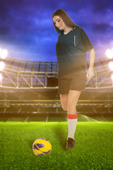 Woman soccer player on stadium