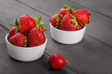 Fresh strawberries in portion bowls