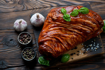 Raw spiced pork knuckle ready to be cooked, studio shot