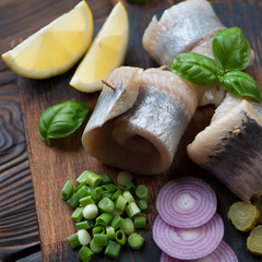 Still life with herring filet rollmops, closeup, selective focus