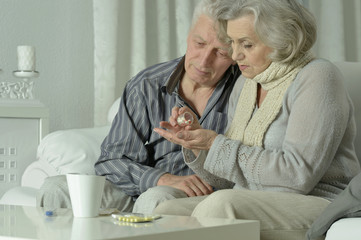 sick Elderly  couple  with pills