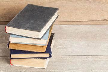 Old vintage books on a wooden table