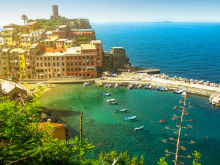 Fototapeta premium Panoramic View of Vernazza at sunset, one of the jewels of Cinque Terre National Park, Unesco Heritage. Liguria, Italy.