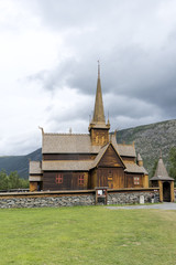 Fototapeta na wymiar Old stave church in Lom, Norway. The church Lom Kyrkje dates from the 12th century.
