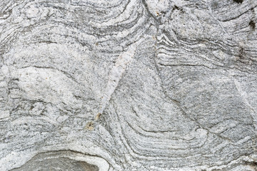 Naklejka premium Textured background of a granite rock polished be glaciers during the ice age.