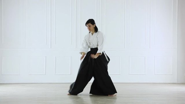 beautiful woman practicing Aikido